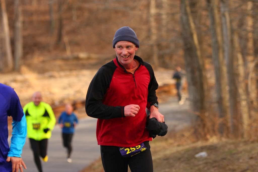 Carlton Conant of Kensington grins while climbing a hill during the Country Roads Run Five Mile. Photo by Ken Trombatore