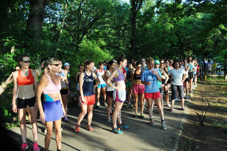 Runners take a moment to ask if they really want to put themselves through a 5k with temperatures in the 90s at the Women's Distance Festival in Bluemont Park. Photo: DC Road Runners