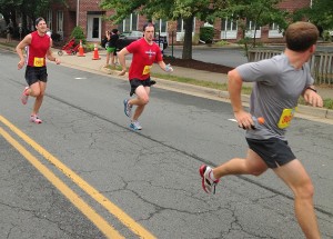 Tyler Duke runs away from Ryan Flynn (left) and some other guy at the end of the Leesburg 20k. Photo: Charlie Ban