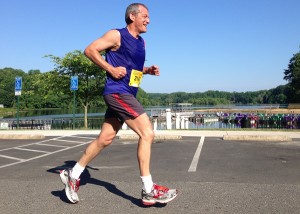 Stephen Nettl of Reston passes Lake Accotink during the Springfield 15k. He finished 83rd in 1:21:47. Photo: Charlie Ban