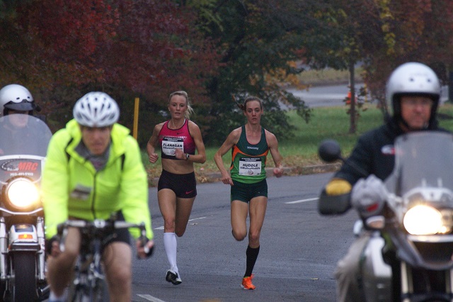 Shalene Flanagan and Molly Huddle run side-by-side approaching six miles at the .US National Road Racing Championships in Alexandria. Photo: Cheryl Young