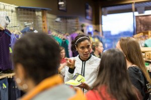 Nikeya Green shows off some shoes at Potomac River Running’s Tysons Corner store. Photo:Dustin Whitlow