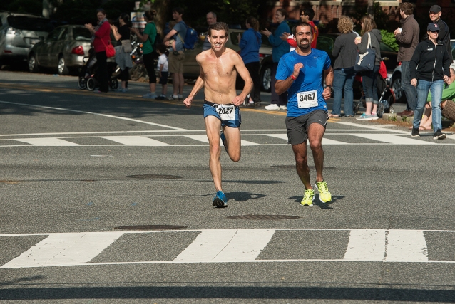 Tristan Holley (l) and Abhaya Menon run to the finish line at the Capitol Hill Classic 10k. Photo: Djenno Bacvic Photography
