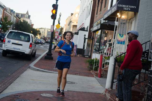 Patricia Chaupis runs from from work through Georgetown. Photo: Jimmy Daly