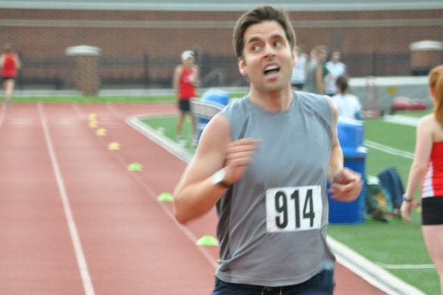 Tyler Cole glances at the clock as he finishes the mile at the DC Road Runners Track Championships. Photo: DC Road Runners