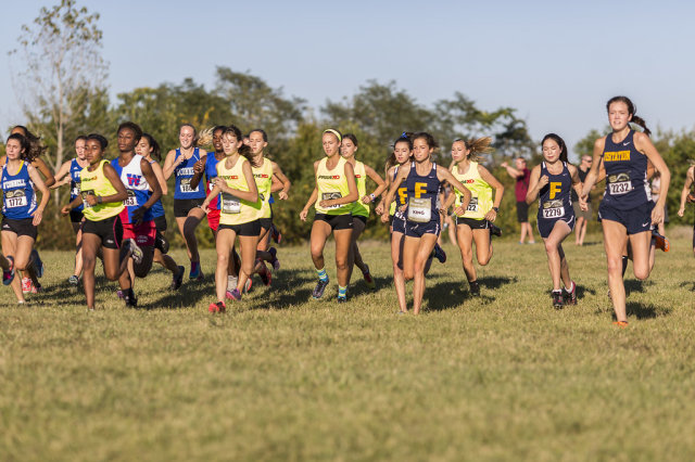 Heritage and the Field School storm the course in the junior girls' race at the DCXC Invitational. Photo: Dustin Whitlow