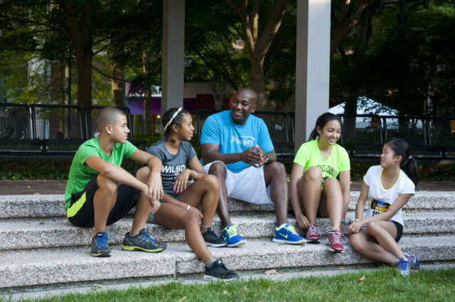 Desmond Dunham counsels his runners before the Crystal City Twilighter. Photo: Meaghan Gay/ Swim Bike Run Photography