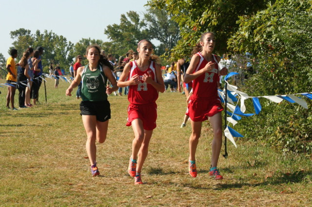 Walter Johnson's Kiernan Keller chases George C. Marshall freshmen Heather and Ashley Holt. Photo: Charlie Ban. (Note: I do not yet know which Holt is which)