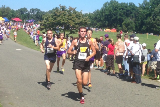 Westfield's Johnny Pace leads Woodson's Robert Lockhart and Lake Braddock's Alex Corbett and Kevin Mongue to the two mile mark at the Monroe Parker Invitational. Photo: Charlie Ban