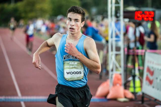 Walt Whitman's Evan Woods crosses the DCXC senior race finish line in 15:20 for a 25 second PR. Photo: Dustin Whitlow