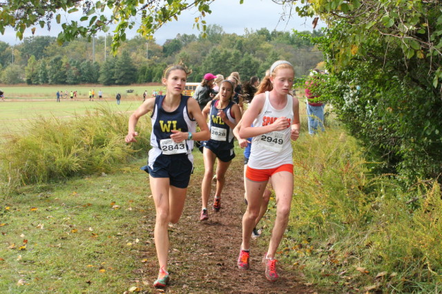 Washinton-Lee's Katherine Eng hunts down teammate Laura Ramirez and West Springfield's Emily Keast with 200 meters to go at the Glory Days Grill Invitational. Photo: Charlie Ban