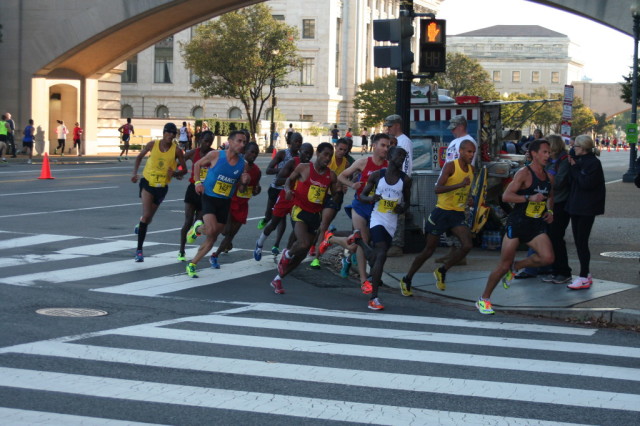 The men's lead pack turns onto the 14th Street Bridge at mile 6.5 of the Army Ten-Miler. Photo: Charlie Ban