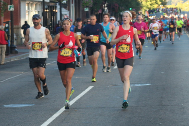 Kelly Swain, left, runs with teammate. Photo: Charlie Ban