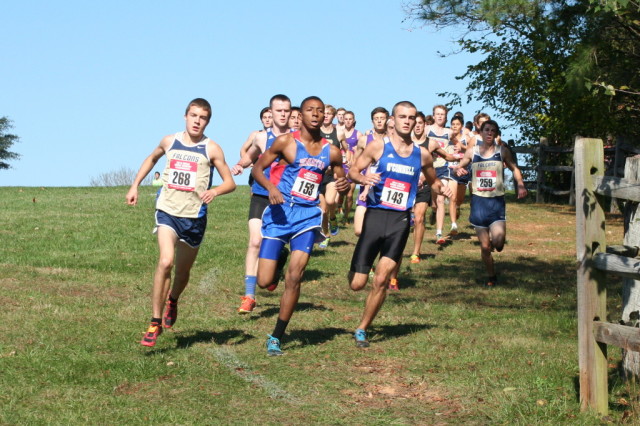 Jack Wavering( Good Counsel), Hampton Holmes (DeMatha) and Kevin Dannaher (O'Connell) battle for the lead early into the WCAC Championships. Photo: Charlie Ban