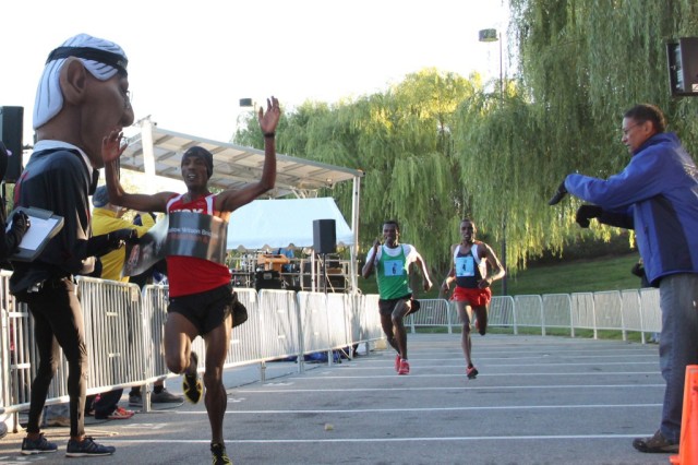 Girma Gebre edges Gosha Tefera and Derege Demie at the Woodrow Wilson Bridge Half Marathon. Photo: Clay Shaw/Karen Mitchell