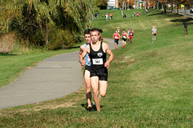 Diego Zarate leads Evan Woods in the Montgomery County Cross Country Championships. Photo: Charlie Ban