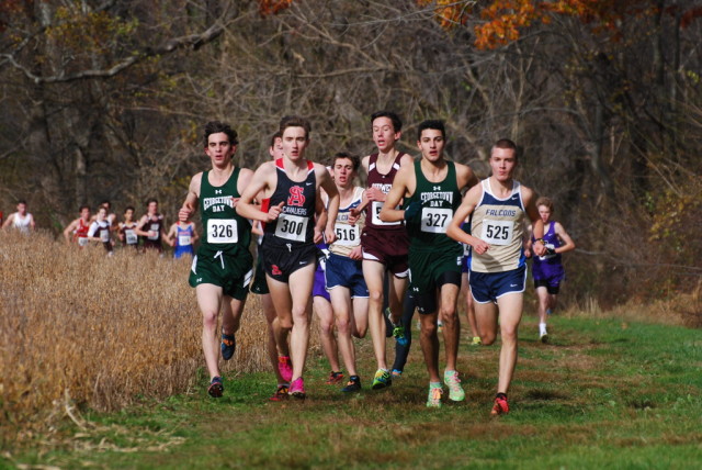 The lead pack of the boys large schools race cruises through the course at Derwood, with eventual champion Jack Wavering on the right end. Photo: Dan DiFonzo
