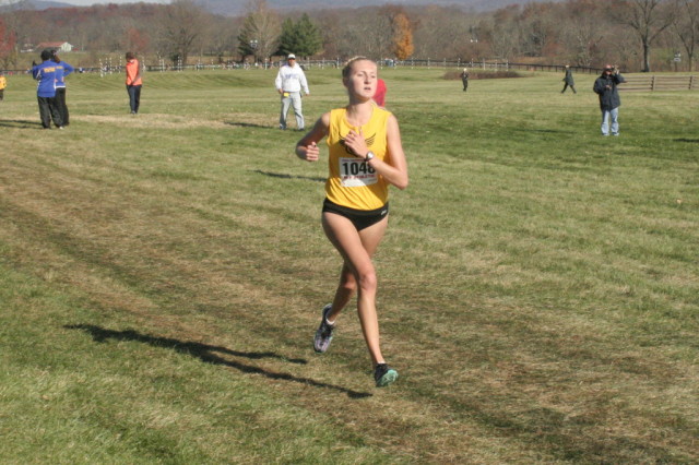 Oakton's Allie Klimkiewicz closes in on third place in the 6A race, and the start of another state championship for the Cougars. Photo: Charlie Ban