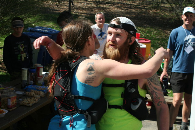 David Lister hugs his wife, Ashley, after finishing the Bull Run 50 Miler. Ashley won the women's overall title. Photo: Charlie Ban