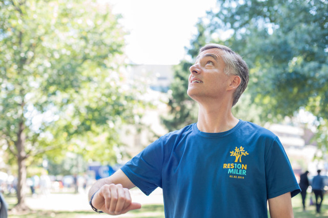 Eric London, a self-proclaimed "gadget addict," waits for a signal on his GPS watch. Photo: Melissa Dorn/Liss Ryan Photography