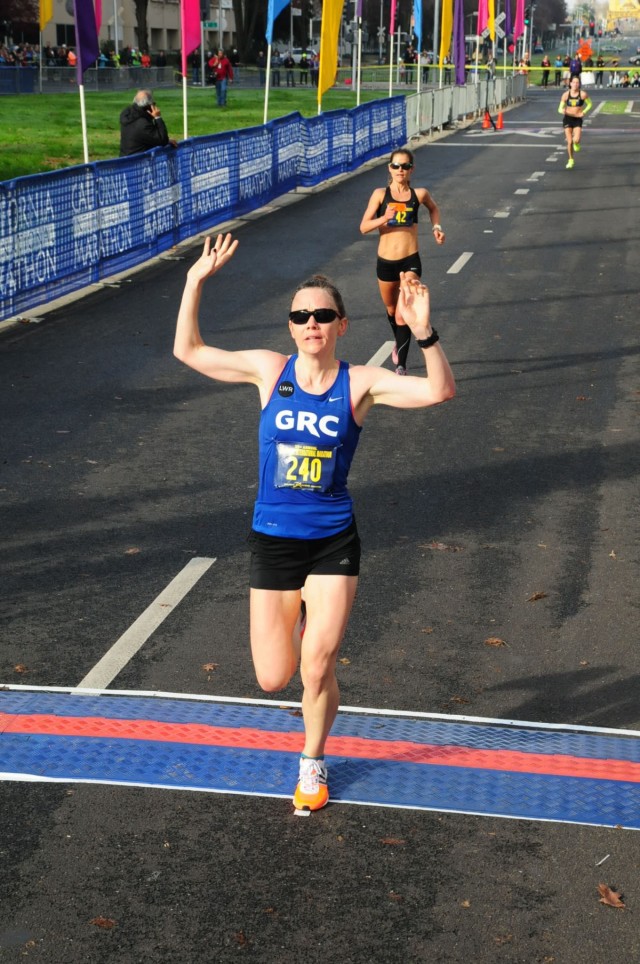 Teal Burrell crosses the finish line at the 2014 California International Marathon. Photo: Sport Photo