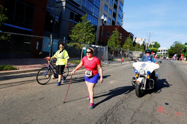 Jamie Watts sets off on the Freedom Four Miler in Arlington in June 2014. Photo: Brian W. Knight/Swim Bike Run Photography