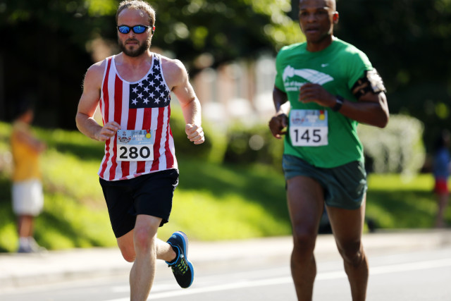 Michael McMunn (left) and Tracey Holtshirley scale Wilson Boulevard. Photo: Brian W. Knight/ Swim Bike Run Photography