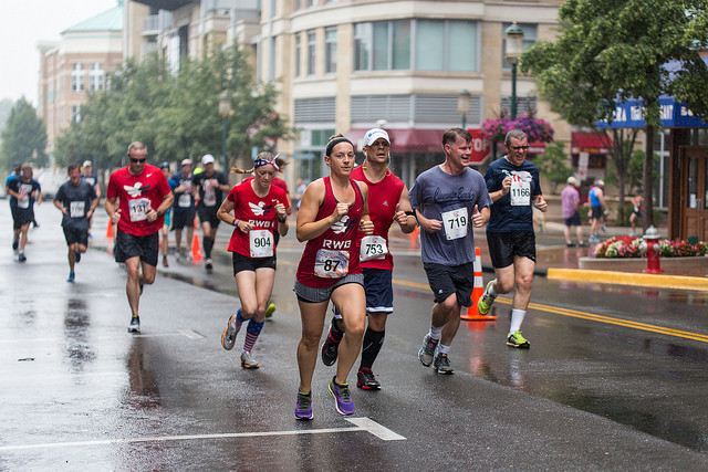 Sarah Bord, of Lorton, leads a group of Team RWB runners at the Firecracker 5k. Photo: Dustin Whitlow