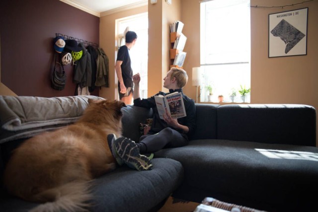 The author relaxes after doing hard marathon training as her husband, Dickson Mercer, heads out the door for his own run. Photo: Sara Alepin/ Photos from the Harty 