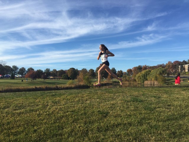 Abbey Green cruises along through Bohrer Park with a healthy lead on her way to breaking the Montgomery County championship course record. Photo: Charlie Ban