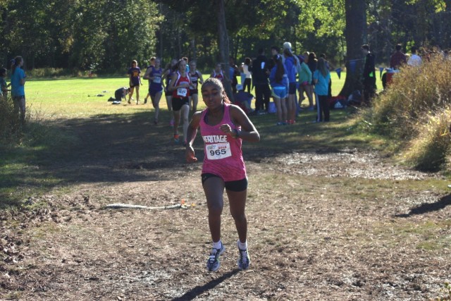 Weini Kelati gets away from the chase pack, which included Heather Holt, Kate Murphy, Taylor Knibb and Sarah Daniels a half mile into the Glory Days Invitational. Photo: Charlie Ban