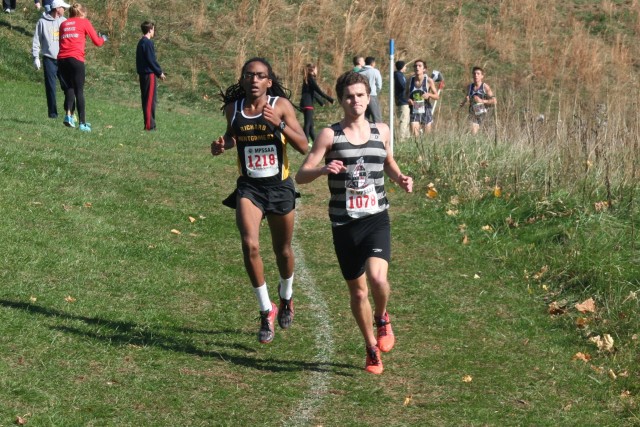 Rohann Asfaw right on Eric Walz's heels at the Maryland 4A championships. Photo: Charlie Ban
