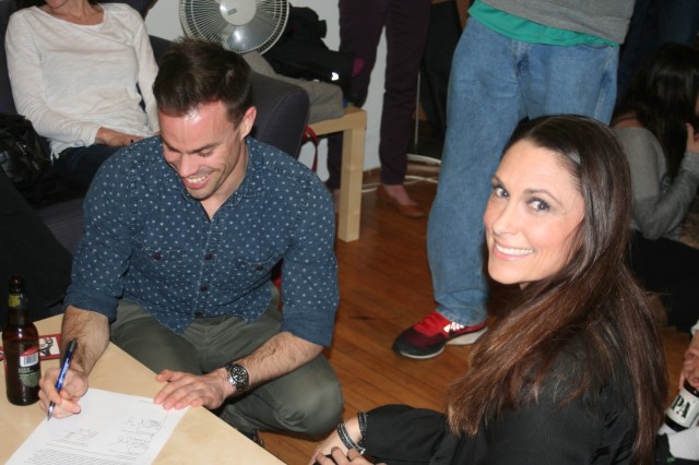 Georgetown Running Club President Sam Luff and Pacers Running CEO Kathy Dalby sign the sponsorship agreement. Photo: Charlie Ban