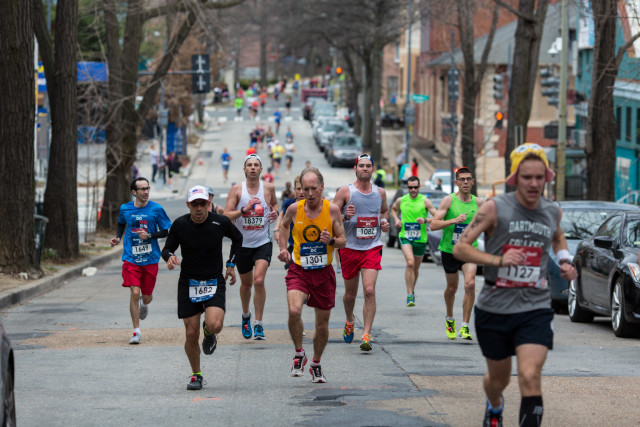 Half marathoners Pedro Aponte and Mark Drosky climb Harvard Street in Columbia Heights as half marathoner Marcello Mannino and marathoners Jason Apple and Rob Halliday give chase. Photo: Dustin Whitlow/DWhit Photography