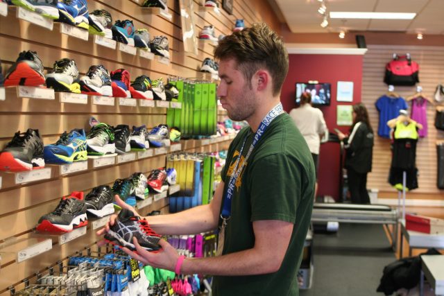 Manager Aaron McCray shows off the Potomac River Running - Burke store. Photo: Charlie Ban 