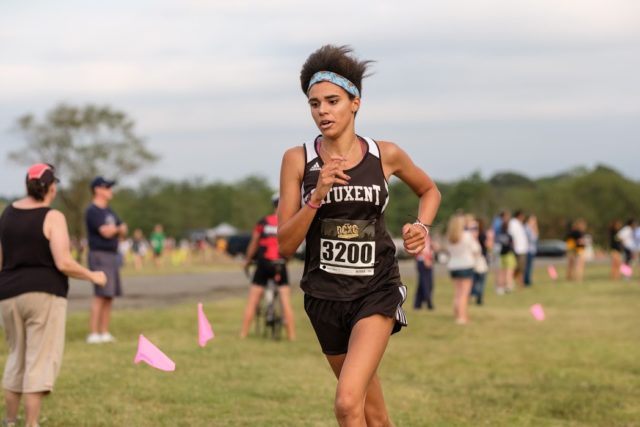 Patuxent's Hayley Jackson cruises to a win in the DCXC Invitational senior race. Photo: Dustin Whitlow/DWhit Photography