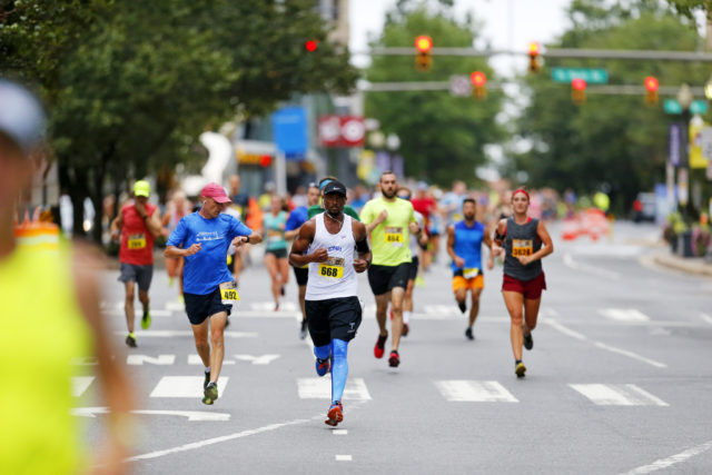 Ashburn's John Johnson storms down Clarendon Boulevard on his way to a 48:10 10k. Photo: Swim Bike Run Photography