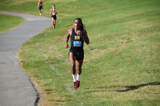 Rohann Asfaw builds on his lead over Adam Nakasaka in the third mile of the Montgomery County Cross Country Championships. Photo: Charlie Ban