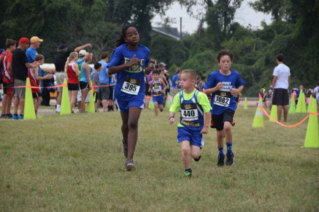 Jalen Bunch, Cort Merritt and Henry Reid race during the DCXC Invitational. Photo: Charlie Ban