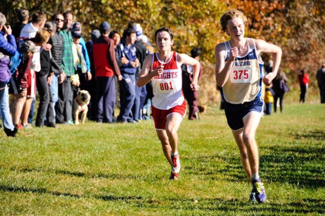 Good Counsel's George Drewyer edges The Heights' Ian Dennis. Photo: Marleen van den Neste