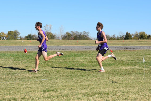 Gonzaga's Harry Monroe leads teammate John Colucci in the second mile of the 2016 DC state cross country championships. Photo: Charlie Ban