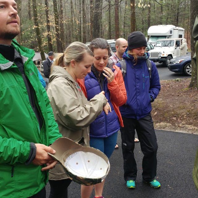 Jessi Kelly (left) and Linda Barton-Robbins check the race time while they wit for Gary Robbins to finish. Photo: Ed Aramayo