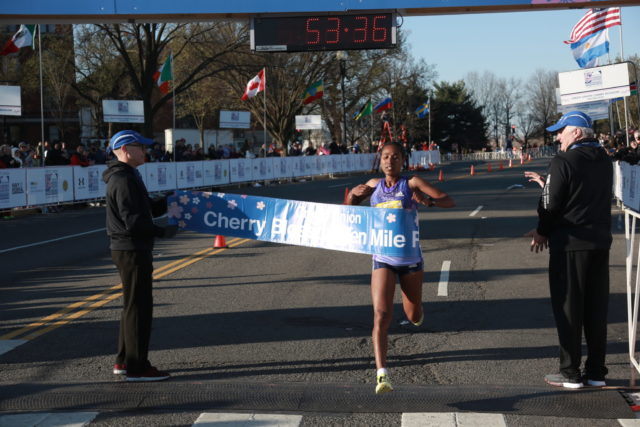 Hiwot Gebrekidan crosses the finish line at the 207 Cherry Blossom Ten Mile. Photo: courtesy of Keith Peters 