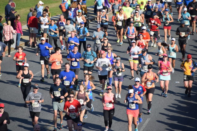 Runners approach the 10 mile mark in the 2017 Marine Corps Marathon. Photo: Charlie Ban