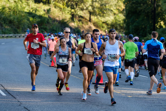 Sarah Bishop and Meghan Curran approach the nine mile mark of the 2017 Marine Corps Marathon. Photo: Dustin Whitlow