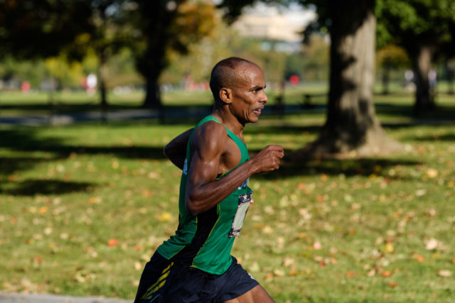 Desto Morkama chases Kieran O'Connor in the 17th mile of the 2017 Marine Corps Marathon. Photo: Dustin Whitlow