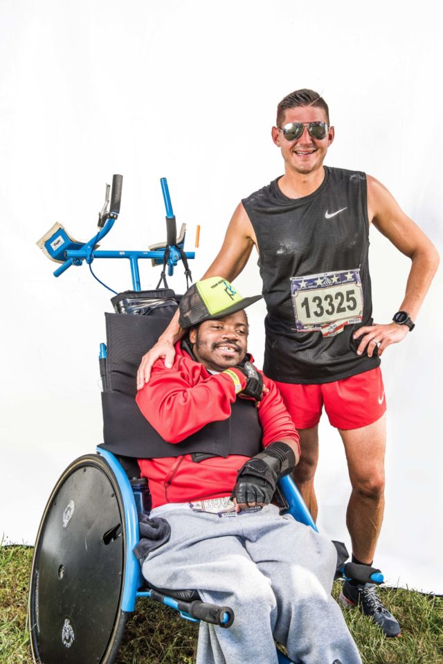Photo By Doug Stroud Team "Big D and Marc", Marc Hodulich, (37), of Atlanta, GA and Don Tavious Ridley in the in the recumbent wheel chair participated in the 2017 Marine Corps Marathon and their first marathon as team together finishing with a time of 3:58:41. Big D, "I asked Marc if we could do another marathon together during the race, I had such a good time", Marc responded- rather hoarsely, laughingly, "Let's finish this one first". Big D went on to say that, "This is the most fun I've had in a long time, I hope we can go to other countries like Canada. I want to do bigger and better places".