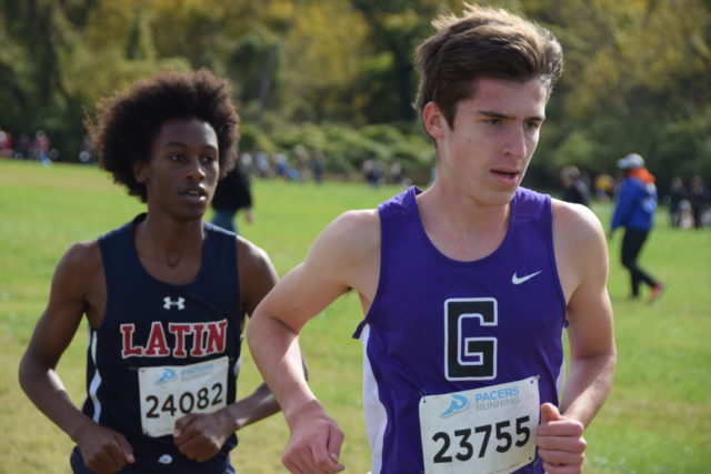 Luke Tewalt (left) clings to Gavin McElhennon halfway through the D.C. state cross country championships. Photo: Charlie Ban