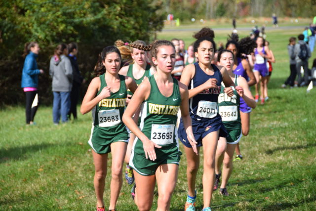 Michaela Kirvan (center) leads a pack through mile 2 of the D.C. state championships. To her left is Brennan Dunne , to her right is Zoe Edelman. Photo: Charlie Ban